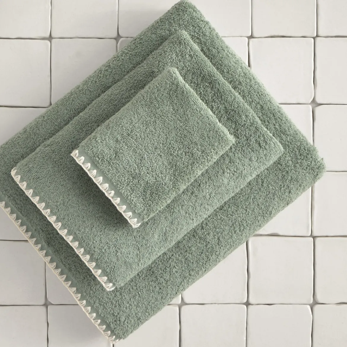 Toalla baño rizo algodón pespunte Unimax